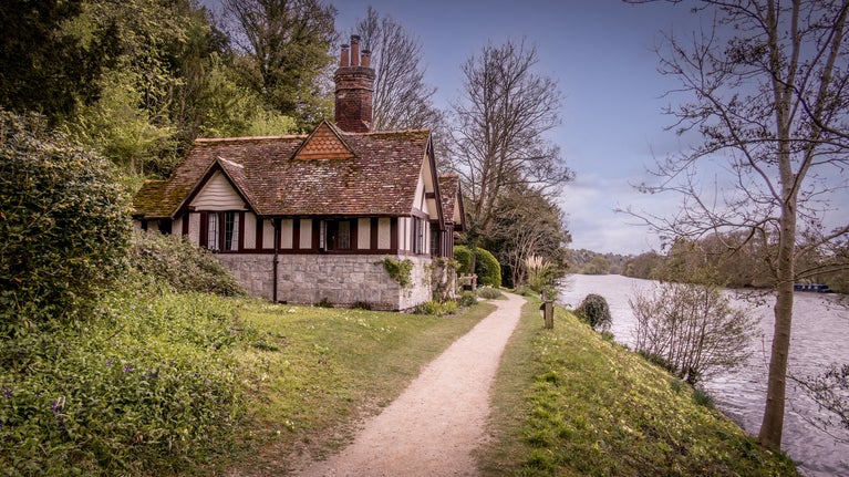 Cliveden Ferry Cottage, beside a footpath on the bank of the River Thames, Berkshire